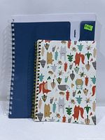 Front view showing both notebooks, blue Pukka and animal pattern
