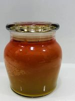Jar candle with lid showing full gradient coloring
