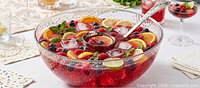 Bowl shown filled with punch and fruit to illustrate size and appearance