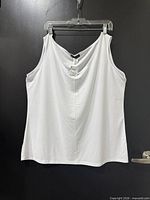 Front view of white tank top on hanger