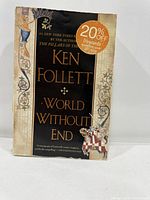 Front cover showing title, author, sticker, wear