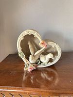 Front view showing heart shape, two doves and floral accents