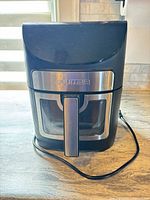 Front view of Gourmia GAF799 air fryer showing basket window and handle