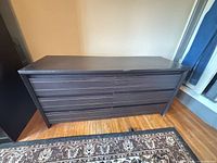 Front view of six-drawer dresser showing overall design and finish