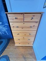 Front view of solid pine six-drawer dresser showing drawer configuration and finish