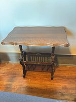 Full view of side table displaying top, legs, magazine rack