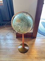 Full view of the floor globe on stand