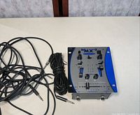 Mixer and bundled audio cables on table