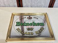 Full view of Heineken mirrored sign with frame