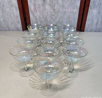 Group shot of all 12 iridescent champagne coupes on table