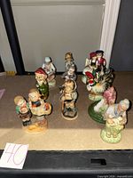All ten figurines grouped on table