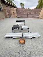 all platforms, stools, bench, small wooden box displayed on driveway
