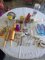 Overview of all utensils, appliances and accessories spread on table