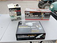 Boxes for Flotec sump pump, Chicago Electric right angle drill, Chicago Electric magnesium drill