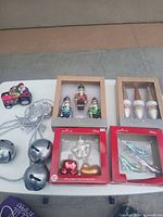 Overview of all boxed sets, jingle bells and loose Santa ornament