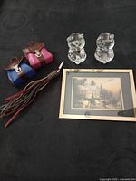 Group shot of print, two glass bears, two mini satchel keychains, tassel keychain