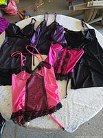 Group shot of all five lingerie pieces laid out on table