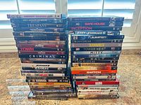 Two tall stacks showing volume of DVD cases and readable spines