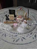 Overall view of assorted figurines and decorative objects on tabletop