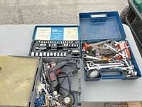 Overview of lot showing SKIL drill, GTT socket set, other hand tools in cases