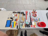 Overview of all hand tools laid out on tables