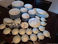 Full layout of Noritake Rosemarie dinnerware pieces on table