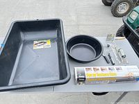 All items on table: mixing tub, pan, boxed spray gun, hand tools