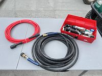 Overall lot with hoses and toolbox showing air tools