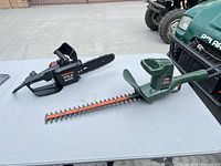 Both tools on table showing full view, identifying logos and blade lengths