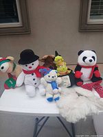 Group shot of all plush toys and accessories on table
