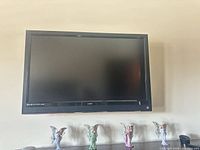 Full front view of Vizio TV mounted on wall