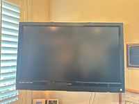 Front view of wall-mounted Vizio flat screen TV