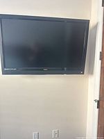 Front view of wall-mounted Vizio TV