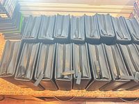 Stack of identical black zippered DVD binders