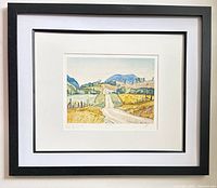 Framed lithograph on wall, full view of frame and mat