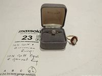 Both rings shown with note card and box