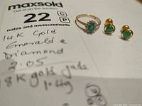 Ring and both earrings displayed together on paperwork
