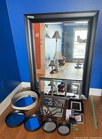 All items group shot showing large rectangular mirror, smaller mirrors and digital frame