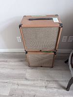 Front view showing brown tolex cabinet stacked, tan cloth grille