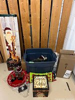 Overall lot showing wall plaque, tote, plate, pillow, candle holder