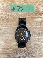 Front view of Fossil black chronograph watch with link bracelet