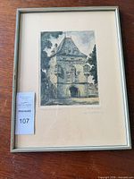 Full view of framed etching showing image, mat and frame