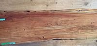 Full surface view of live-edge hardwood slab showing grain, color, and natural edge