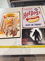 All three metal signs with measuring tape for scale