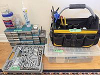 Overall lot with socket set, fastener organizer, silicone caulk, tool tote and bins