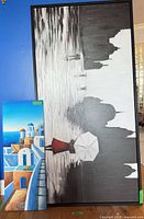 Both canvases leaning against wall showing overall design and relative size