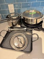Group shot of all cookware pieces including grill pan and immersion blender wand