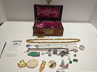 All jewelry pieces laid out with box open showing interior