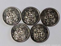 Five Canadian 50-cent coins reverse side