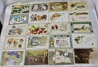 All twenty postcards laid out four rows for complete view